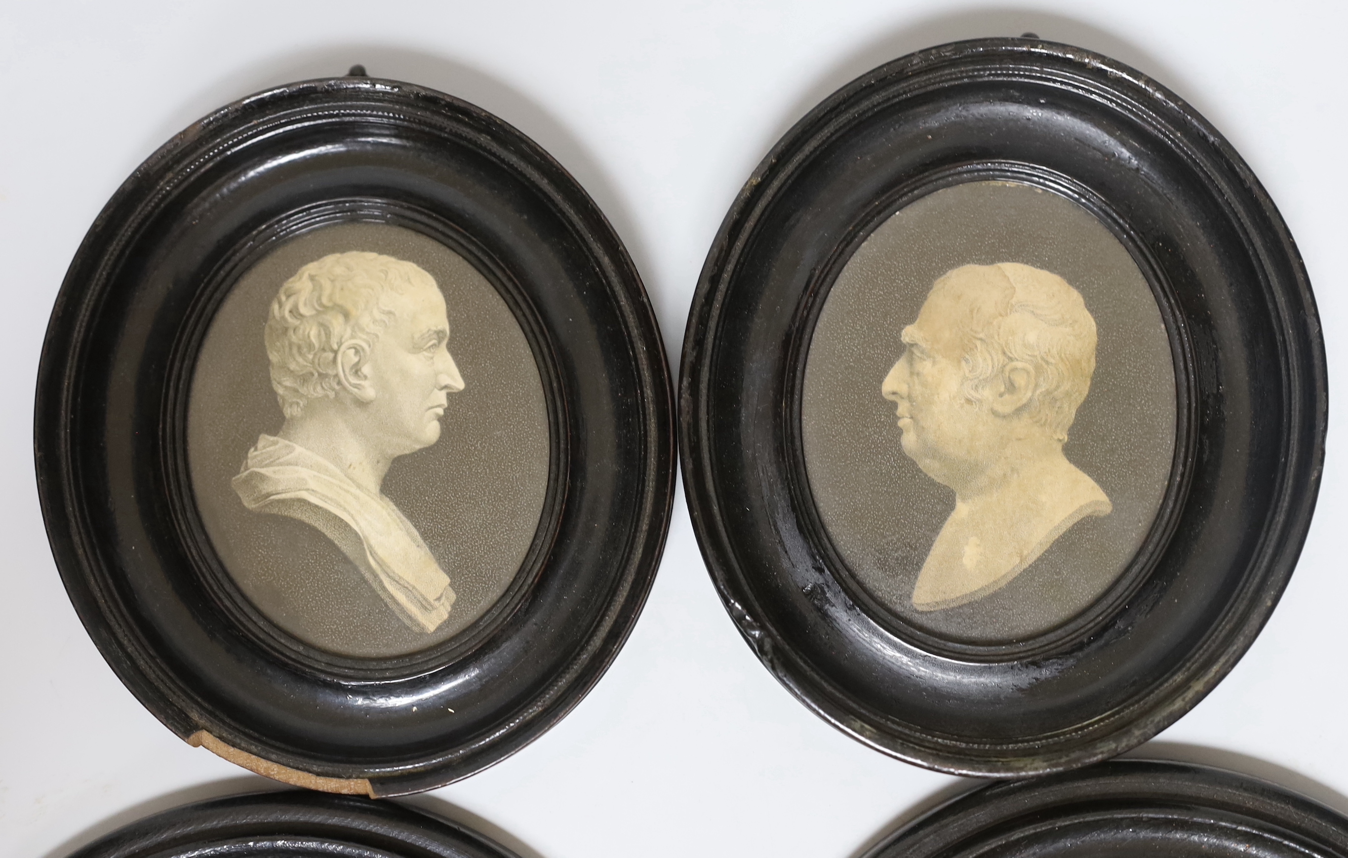 Two Victorian framed pot lids and a pair of framed portrait prints